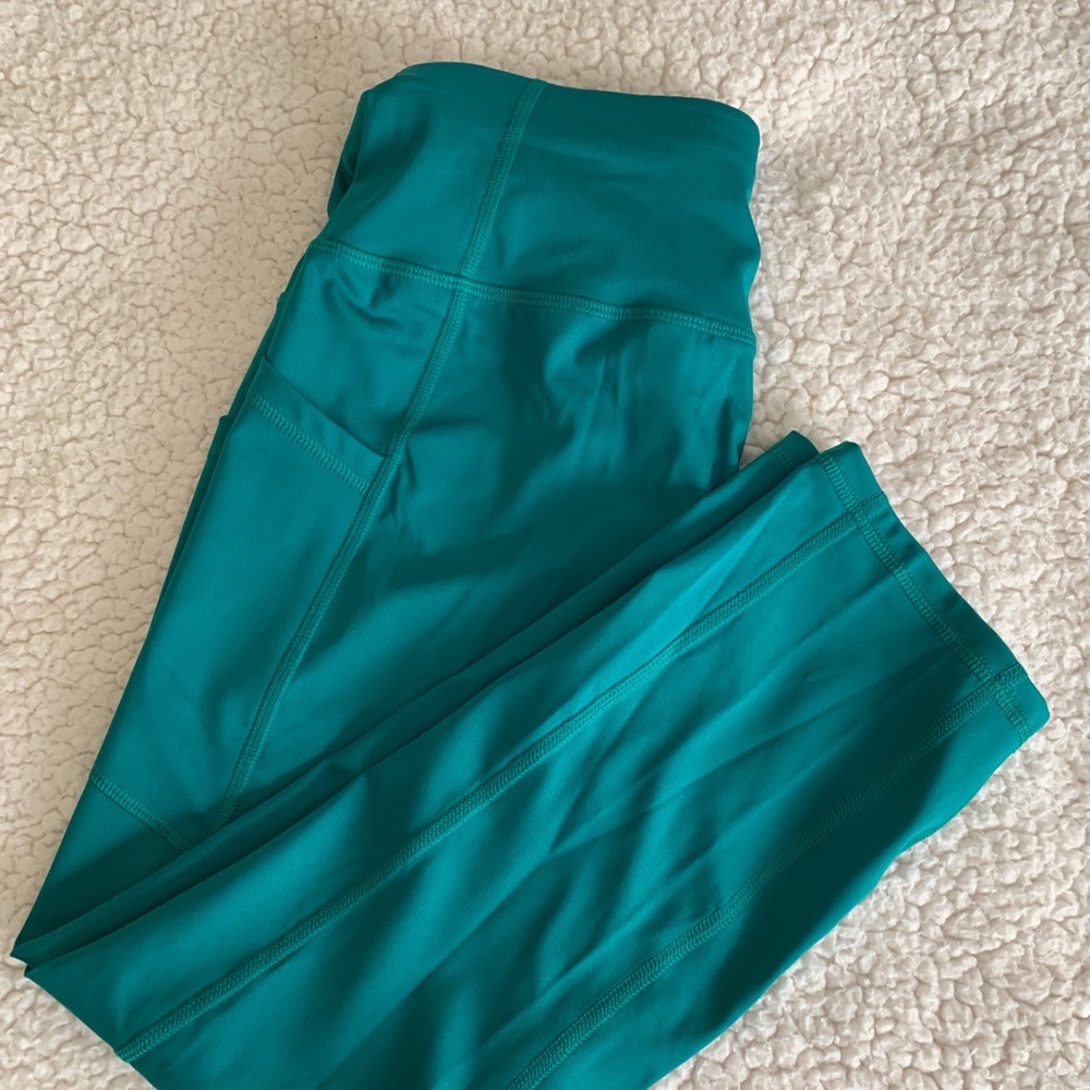 Athletic woman’s green leggings